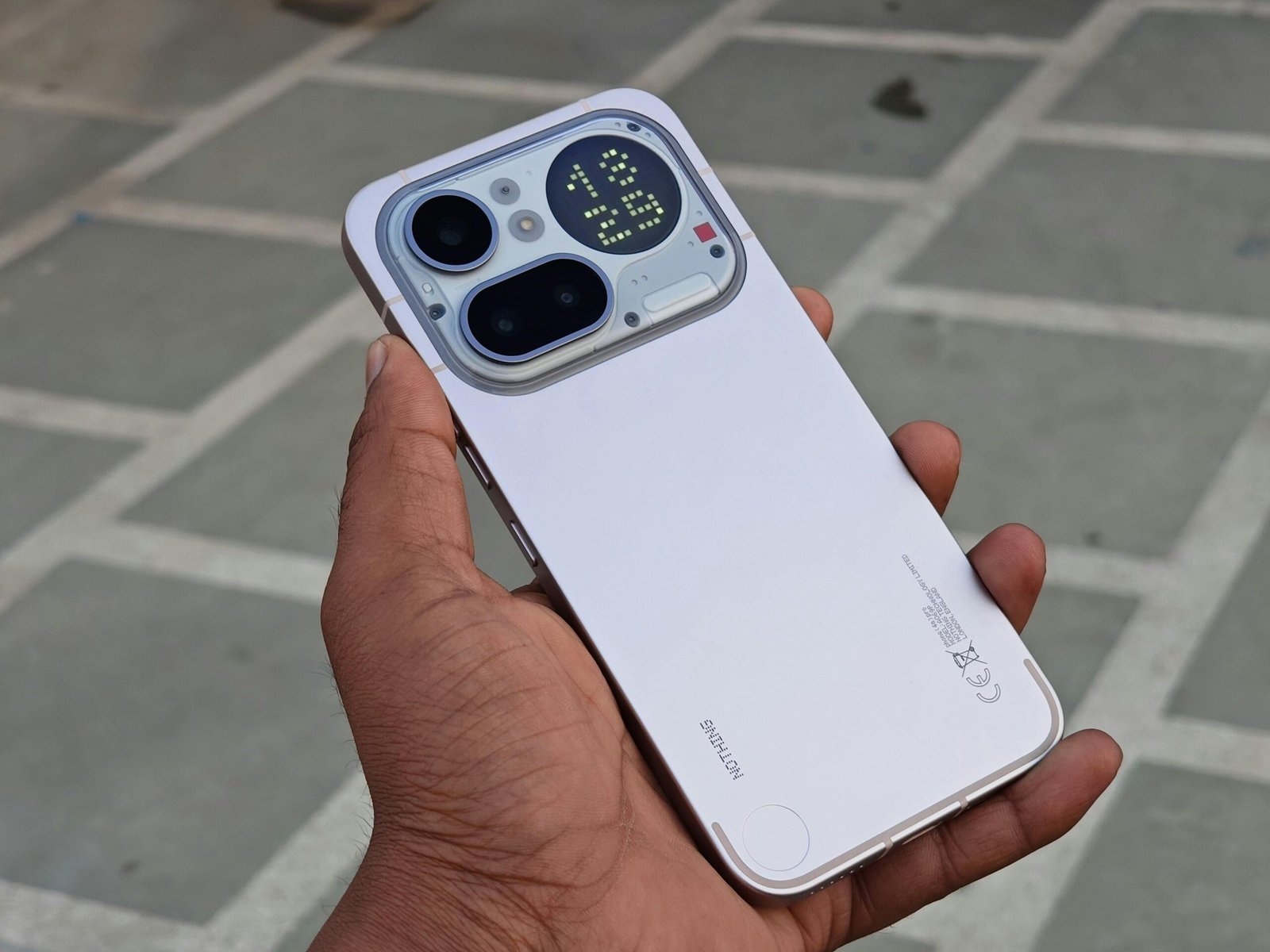 Close-up of a modern smartphone showcasing rear display and camera features.